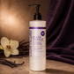 Hydrating conditioner bottle with black pump and front label detailing