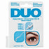 DUO lash adhesive clear packaging with brush for precise application of strip lashes.