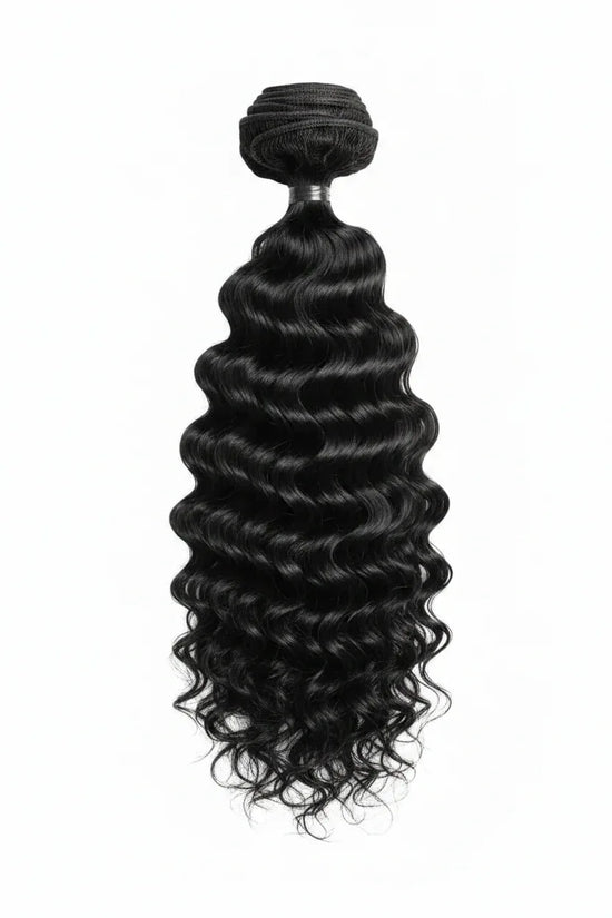 Black curly hair bundle with a visible brand label on a gray background